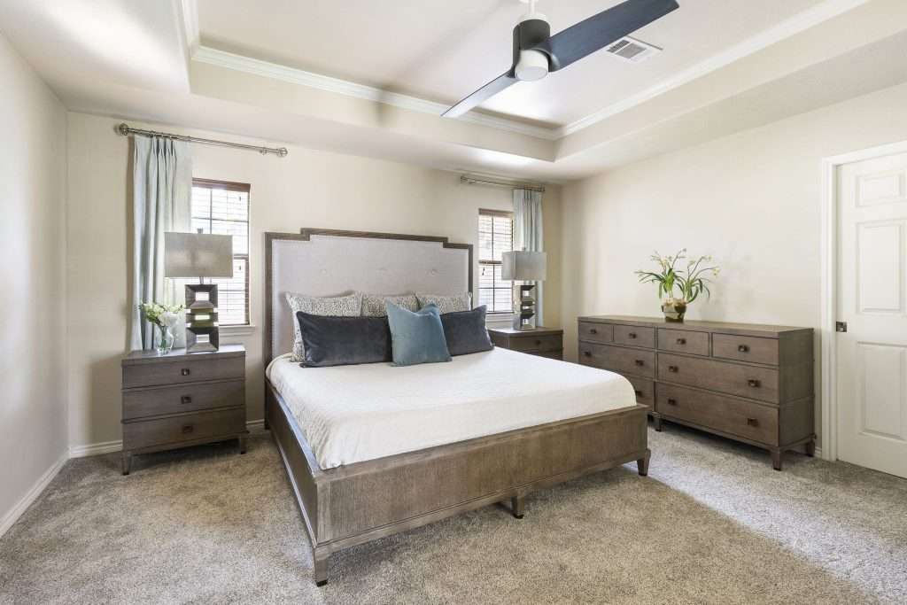 Master Bedroom designed by Design on a Dime Interiors in Montgomery County, Texas