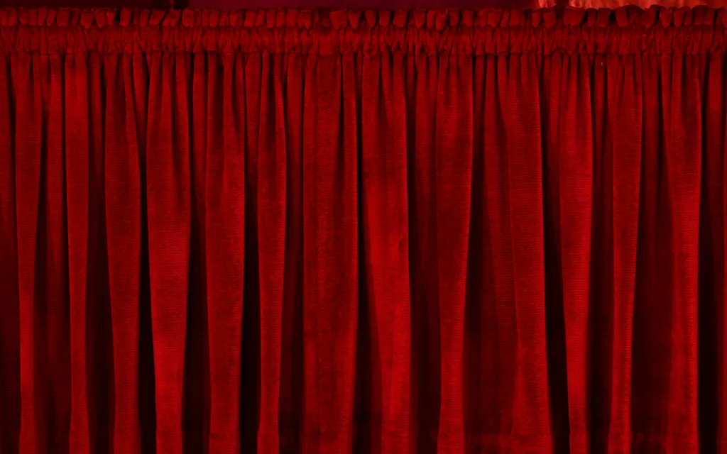 Pinch-pleat curtains in a theatre