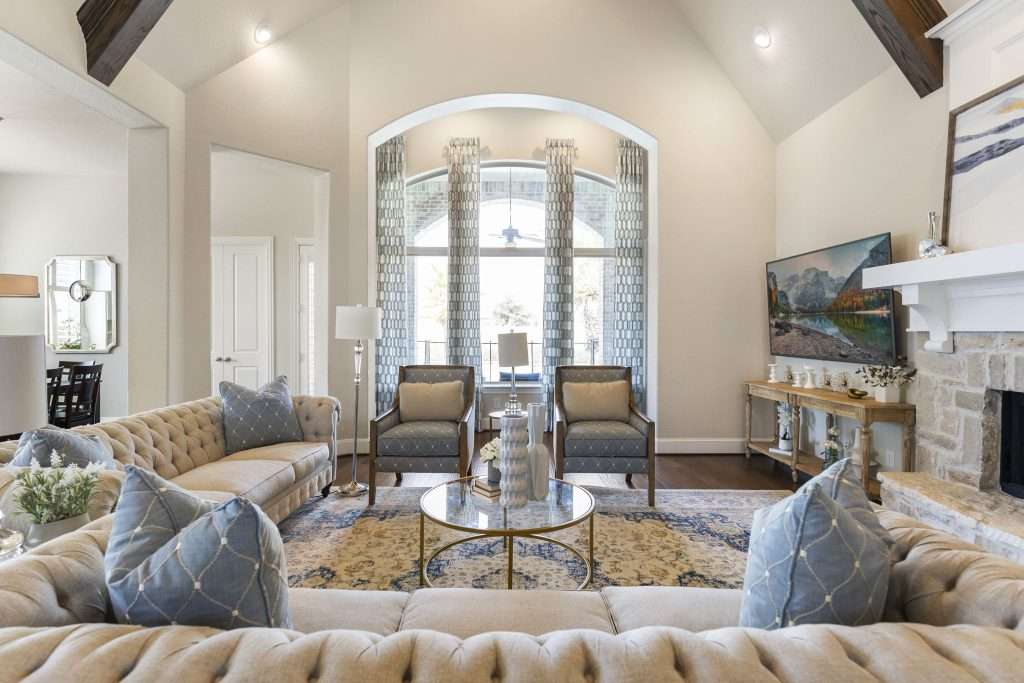 A renovated living space with blue cushions