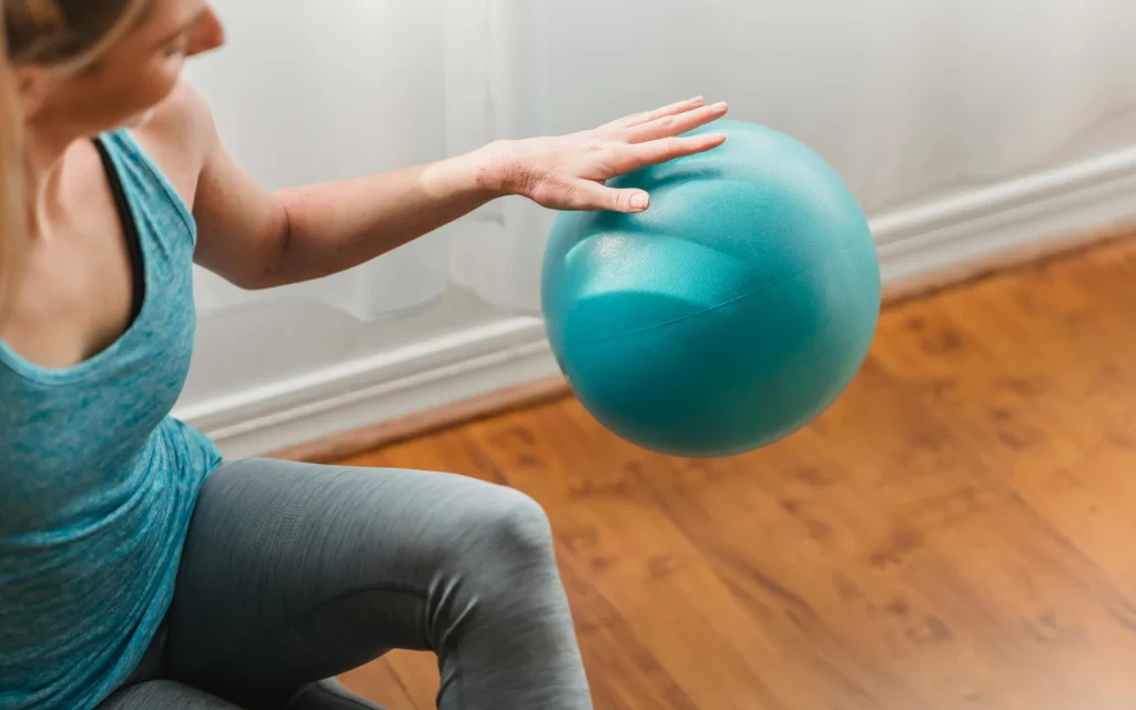A woman exercising on rubber flooring