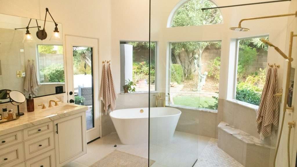 An open-concept bathroom with a tub