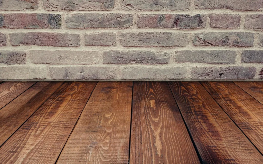 Hardwood floor and brick wall without a carpet