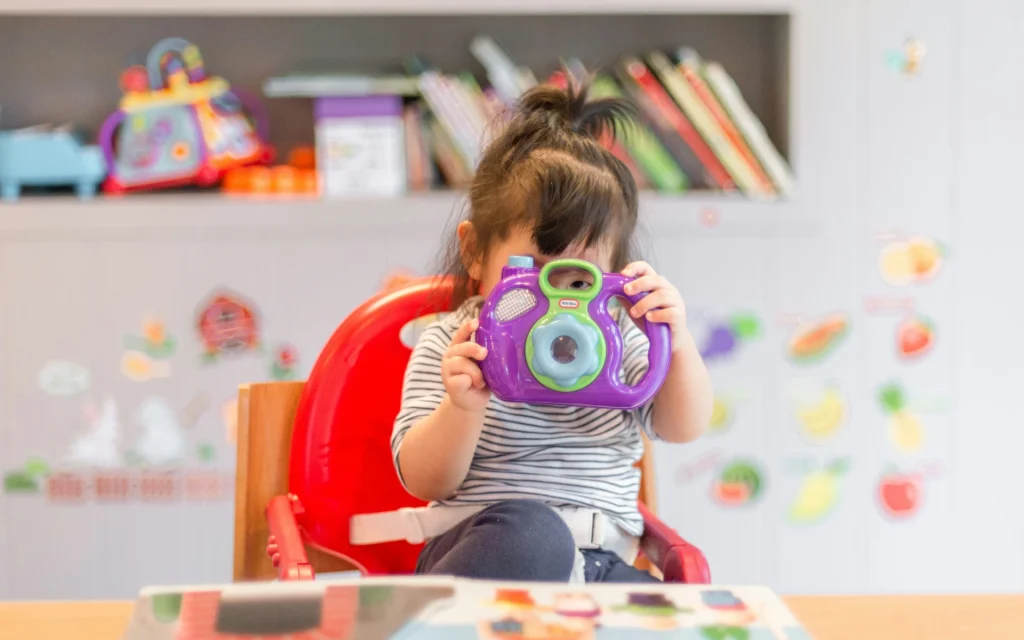 A girl playing with her toy