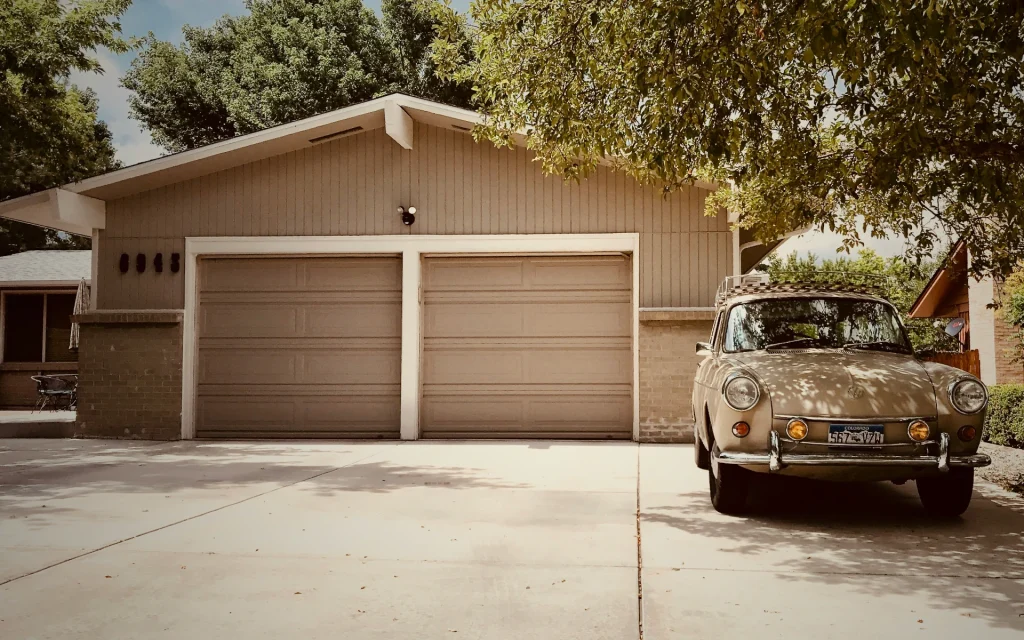 A car in front of a garage