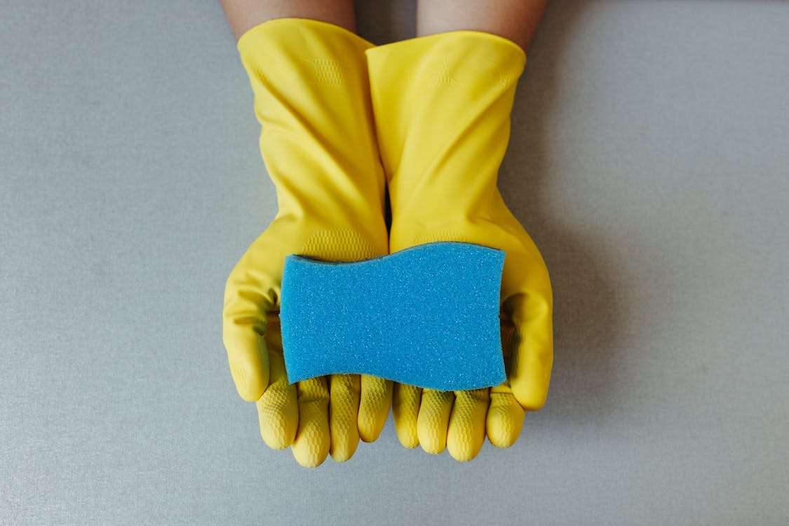 Sponge and gloves for cleaning garage floor