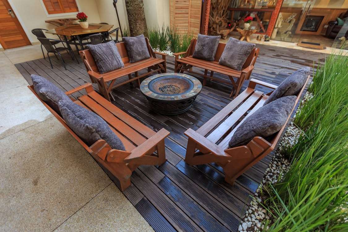 Free Brown Wooden Armchair on Brown Wooden Floor Stock Photo