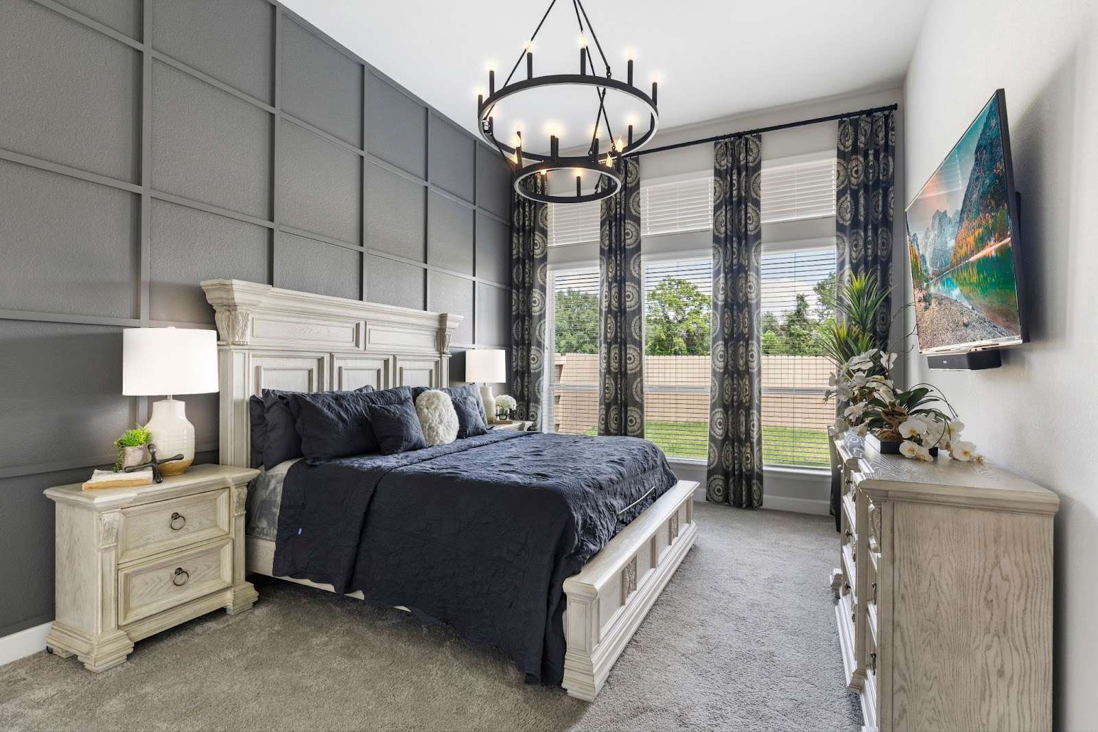 A black accent wall in the bedroom