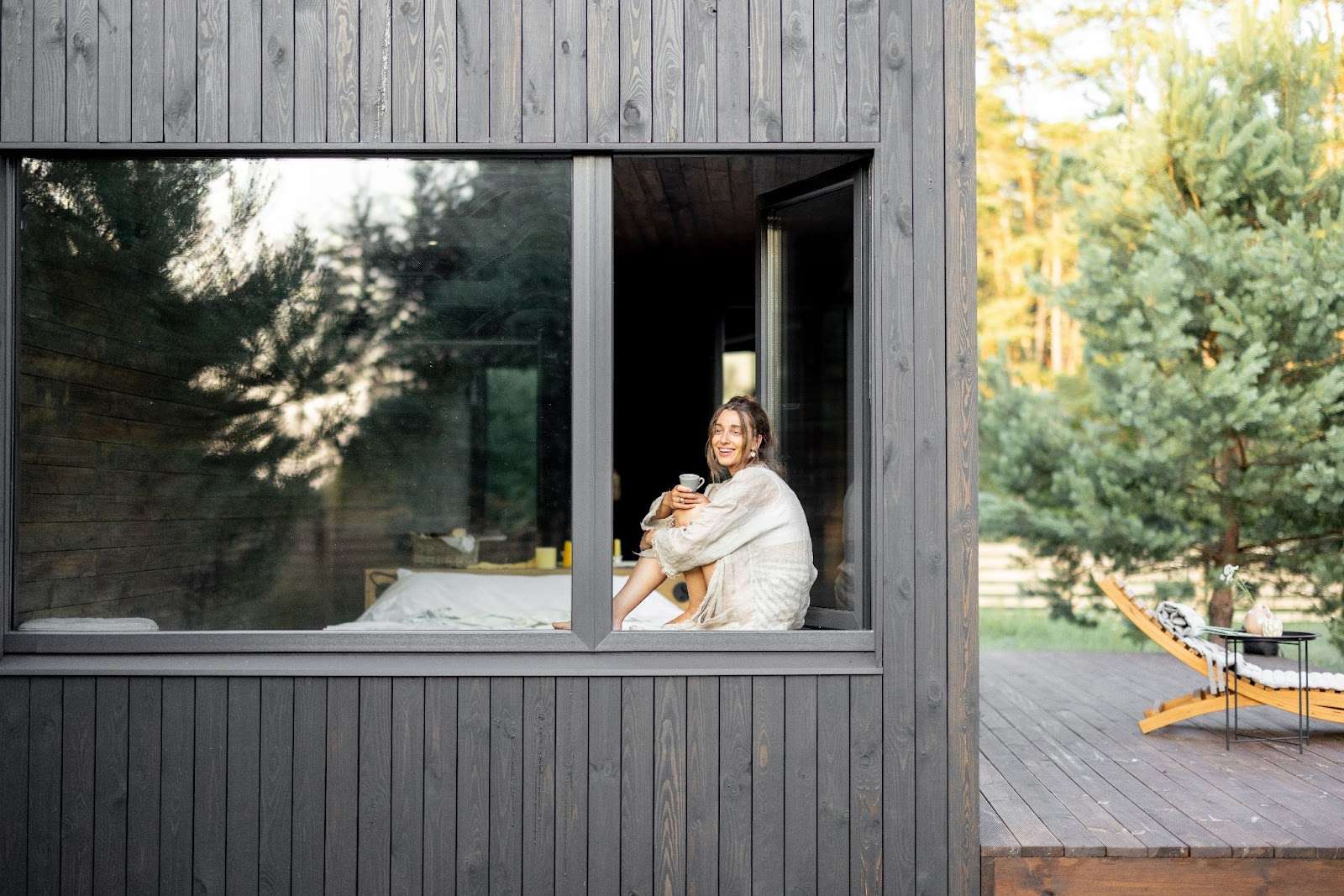 A homeowner enjoying expansive windows