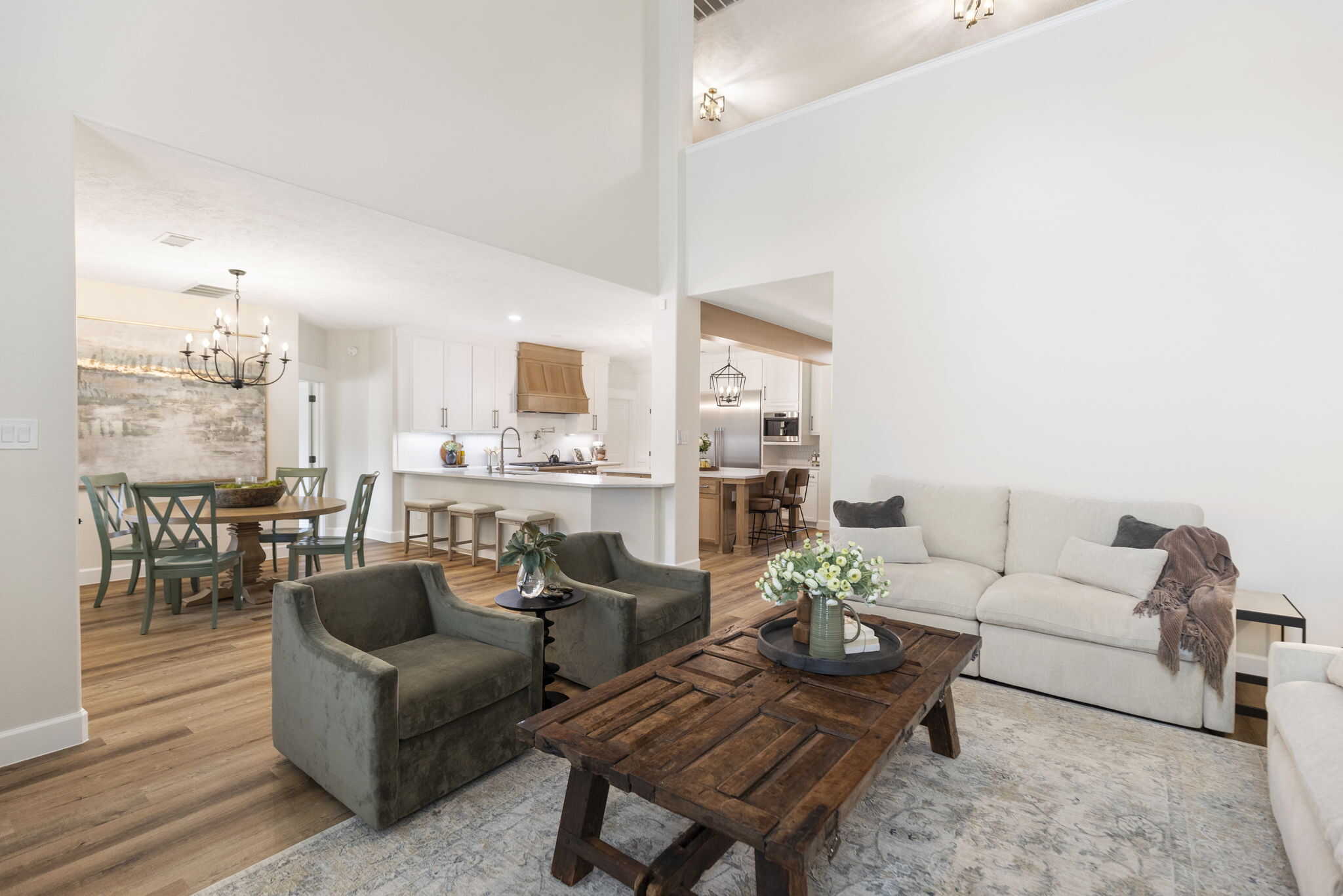 Open concept living room with wooden flooring and modern furniture