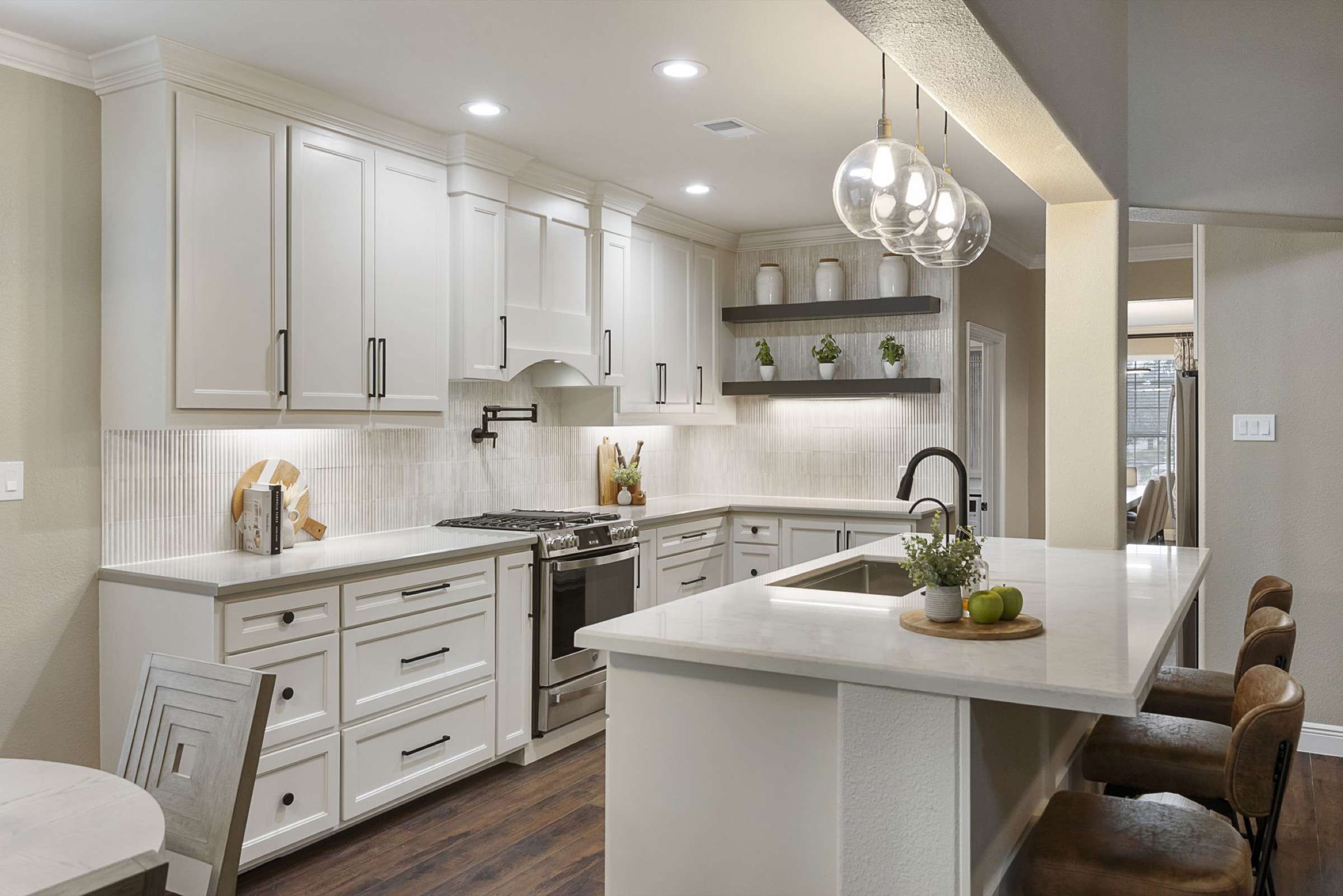 Finished white kitchen remodel by the Design on a Dime Interiors Conroe studio