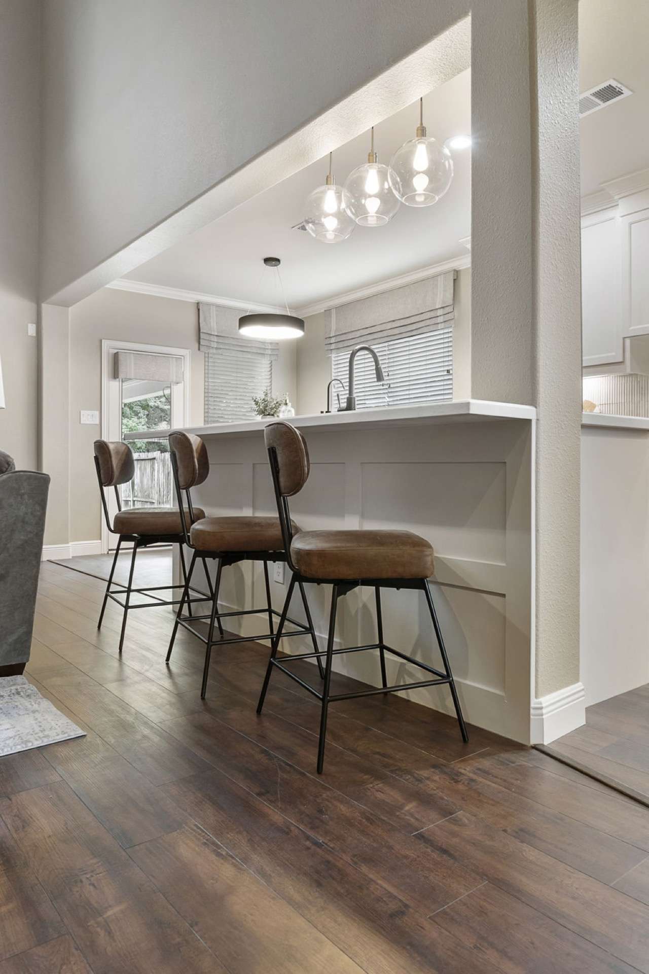 Wide-plank hardwood flooring flowing through an open Texas great room
